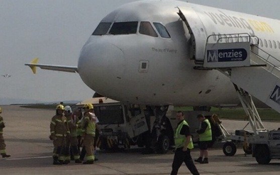 Plane crushes tow truck